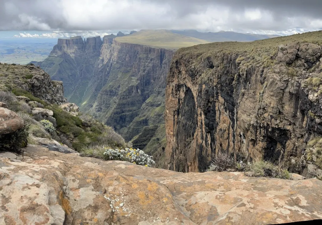 The basalt cliffs of the amphitheatre under dramatic clouds