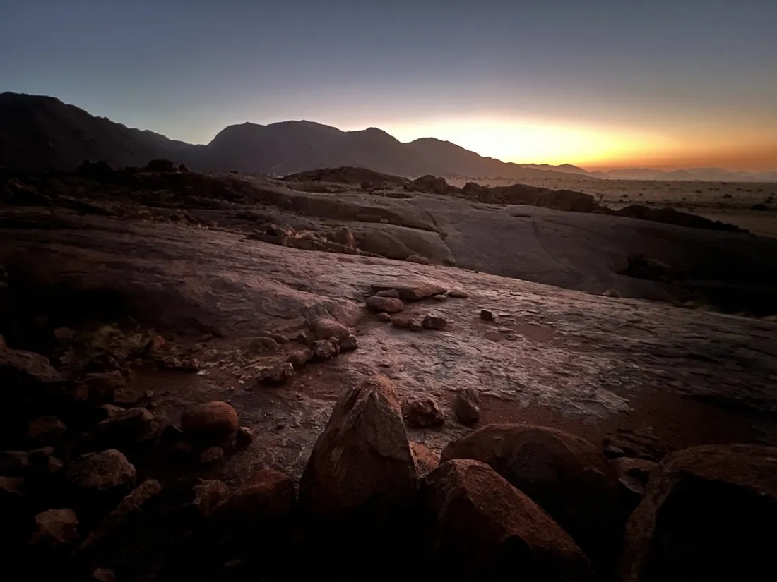 Last light over the rocks of the Tiras Mountains